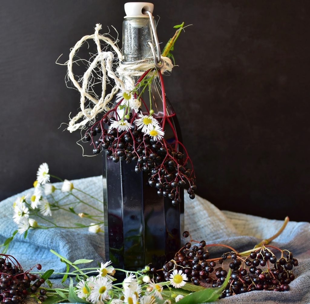 Bottle of Elderberry Wine to help with cold and flu season sickness