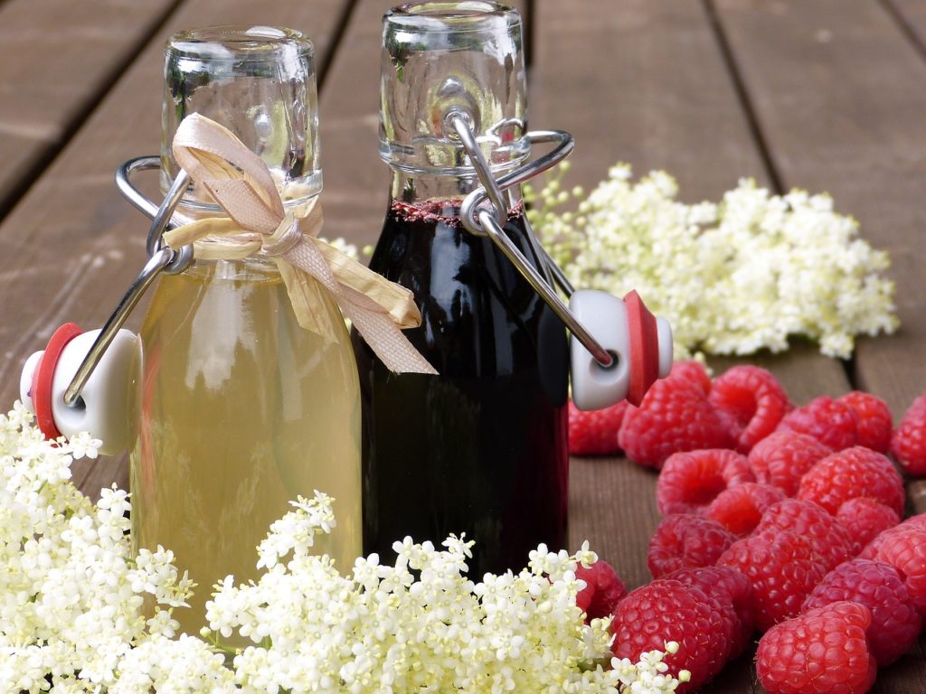 elderberry syrups bottled on table